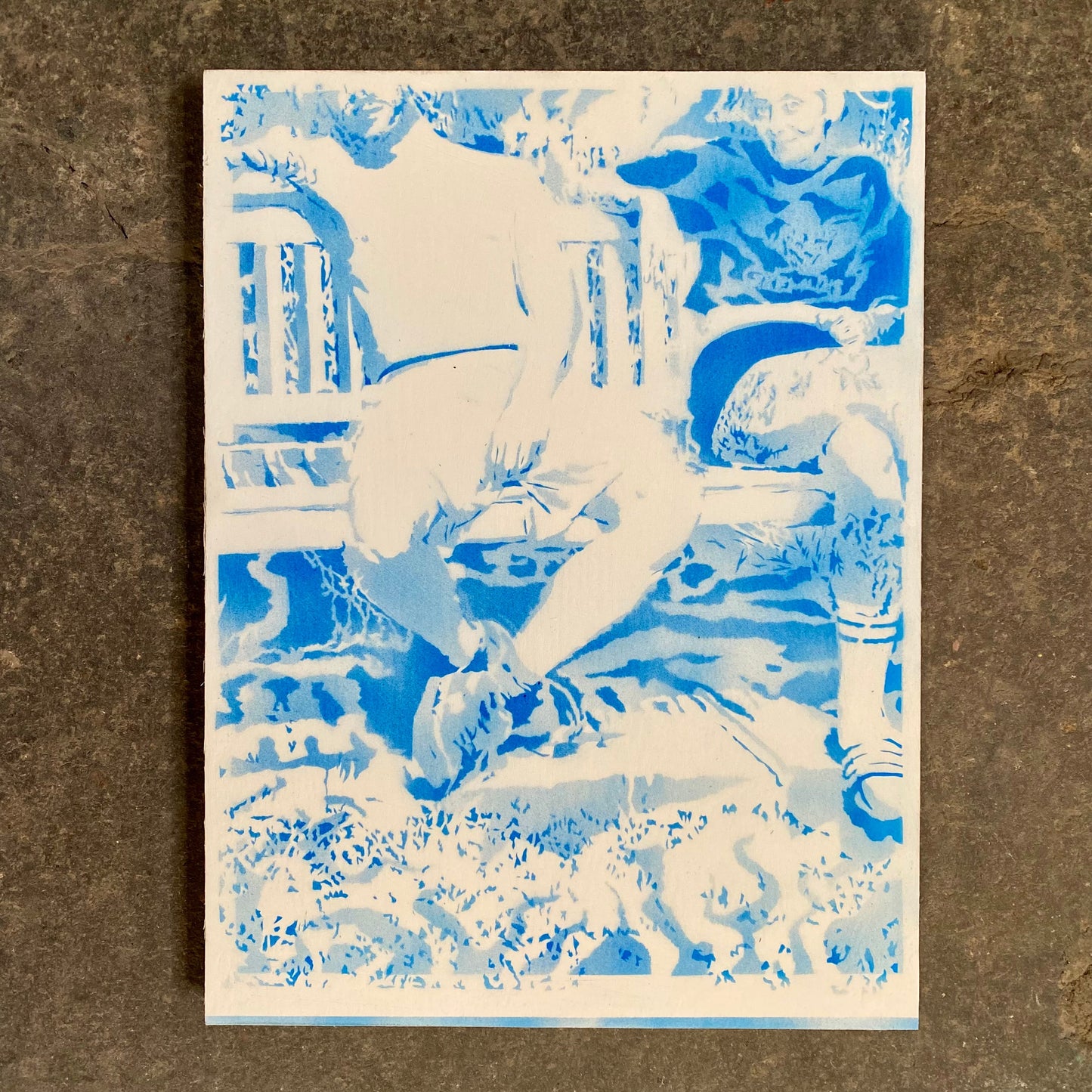 Abstract artwork with blue and white colors on a textured brown background