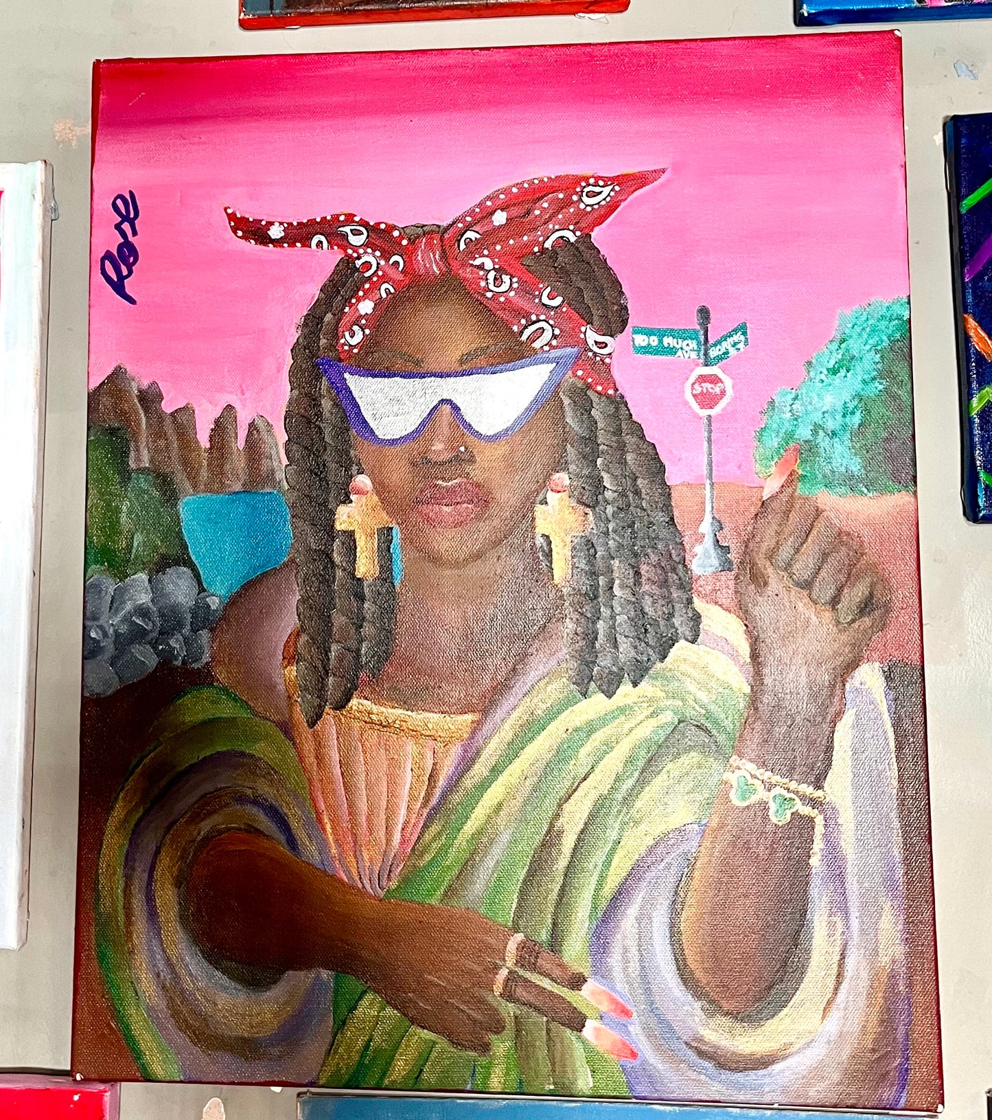 Colorful painting of a woman with a bandana and sunglasses against a pink background