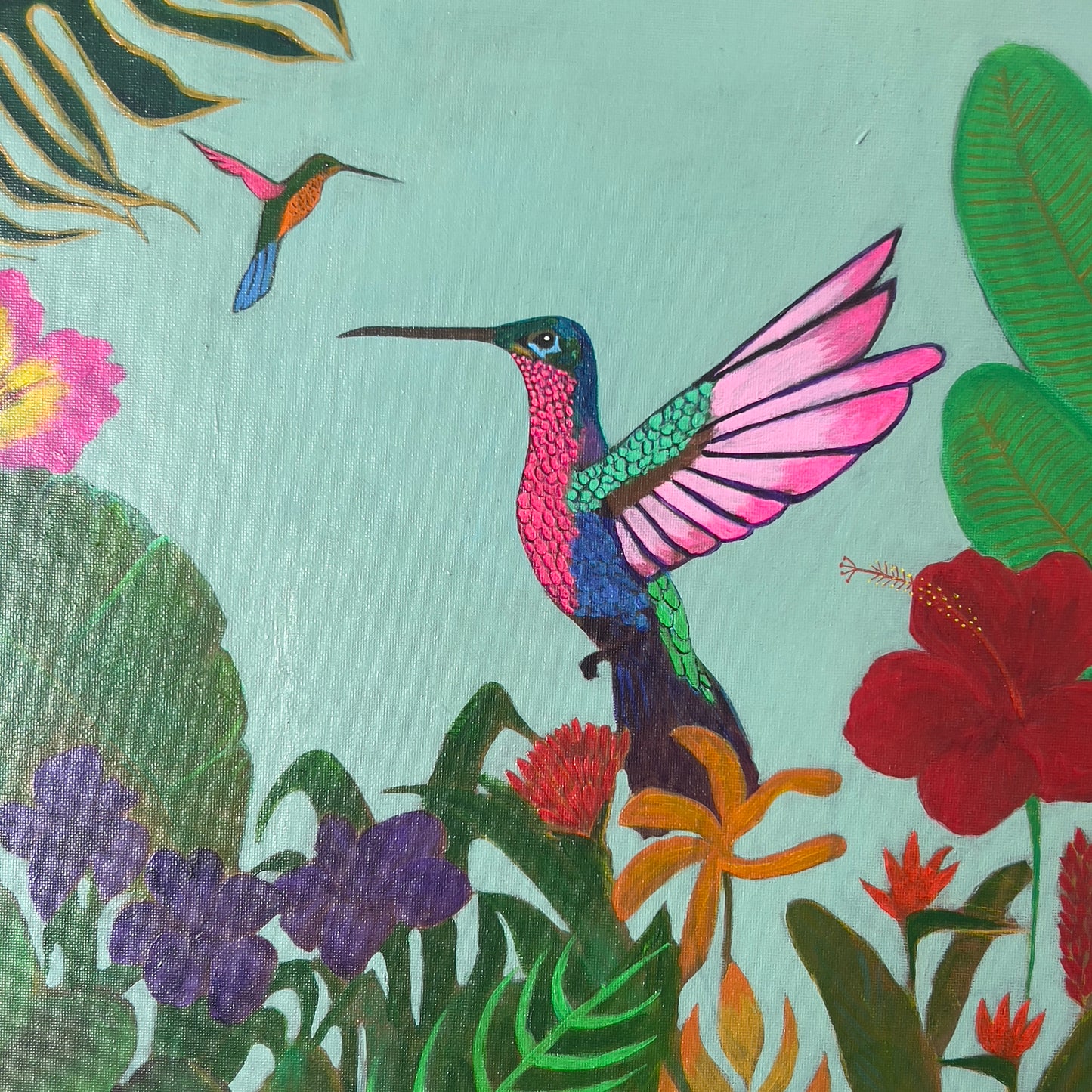 Bright and colorful painting of a vibrant hummingbird in mid-flight surrounded by lush tropical jungle foliage and red hibiscus flowers, available at HEADS Art Gallery.