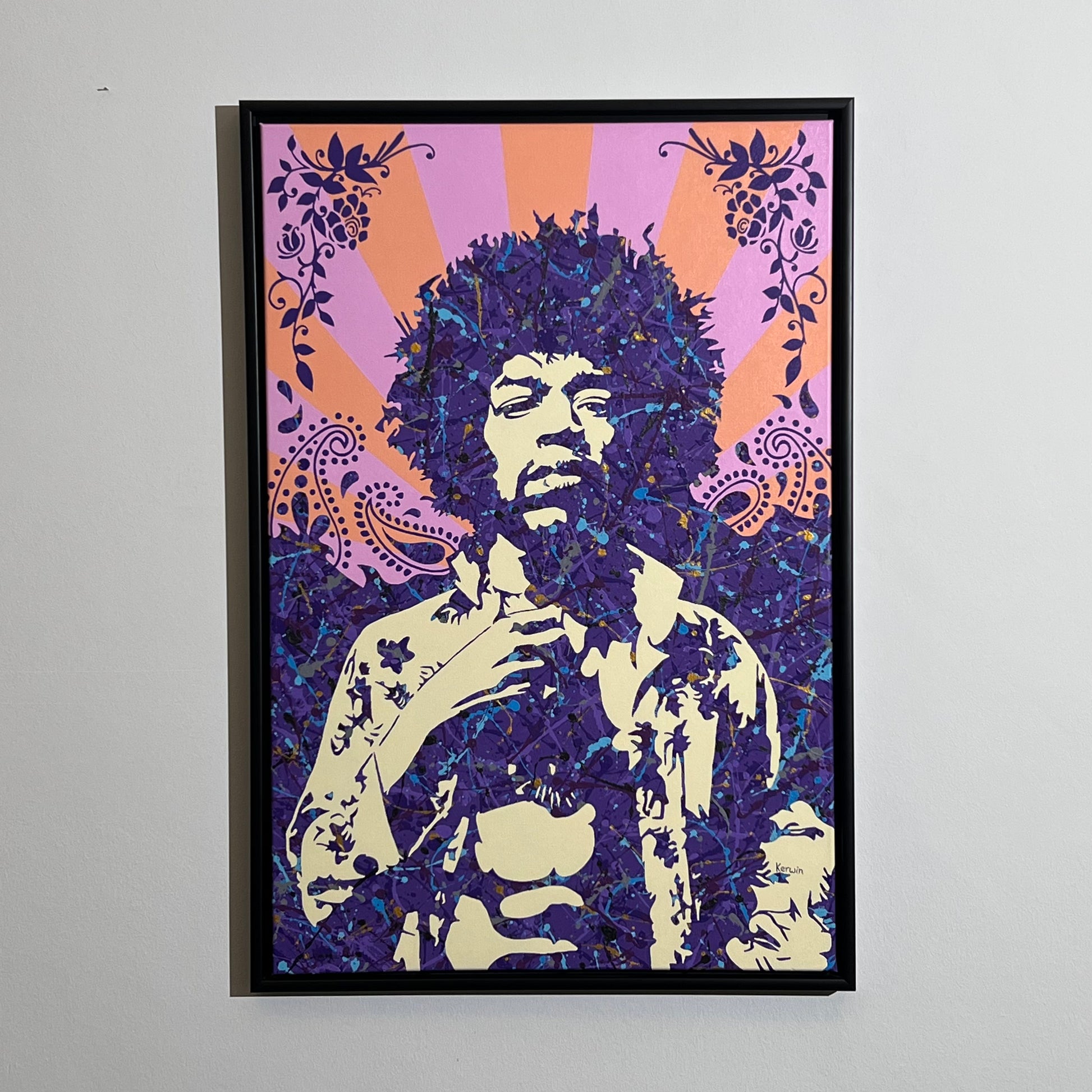 Psychedelic purple and orange splatter art portrait of rock legend Jimi Hendrix featuring paisley patterns and floral borders, available at HEADS Art Gallery.