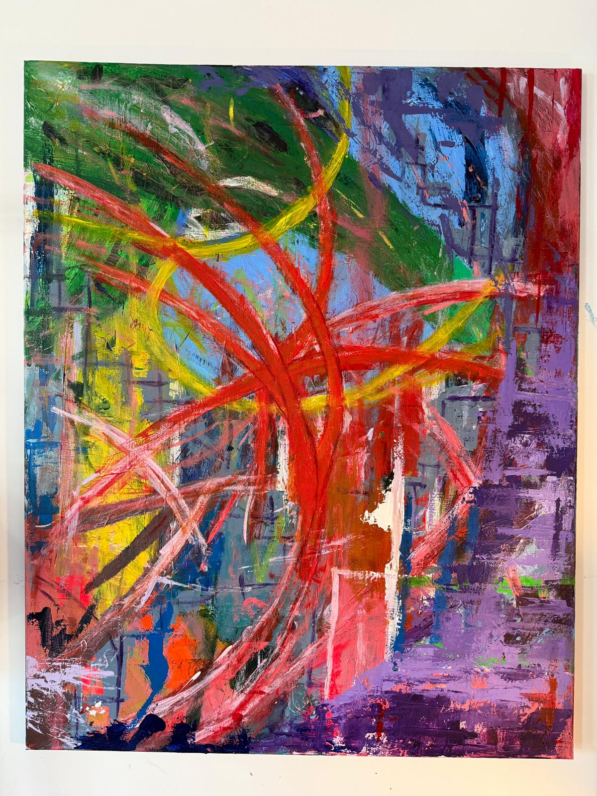 Abstract painting with vibrant colors on a white wall