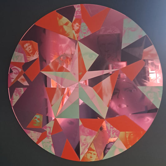 Circular multi-faceted mirror wall art featuring various printed portraits of David Bowie in a geometric star pattern, available at HEADS Art Gallery