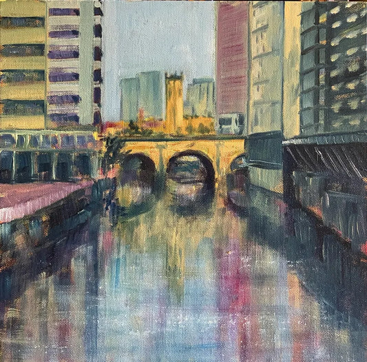 Impressionist oil painting of a stone bridge over a city canal reflecting the surrounding tall buildings in soft purple and yellow light, available at HEADS Art Gallery.