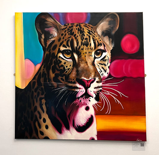 Wildlife portrait of a leopard’s face set against a vibrant abstract background of glowing pink and red circles, available at HEADS Art Gallery.