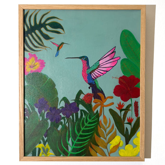 Bright and colorful painting of a vibrant hummingbird in mid-flight surrounded by lush tropical jungle foliage and red hibiscus flowers, available at HEADS Art Gallery.