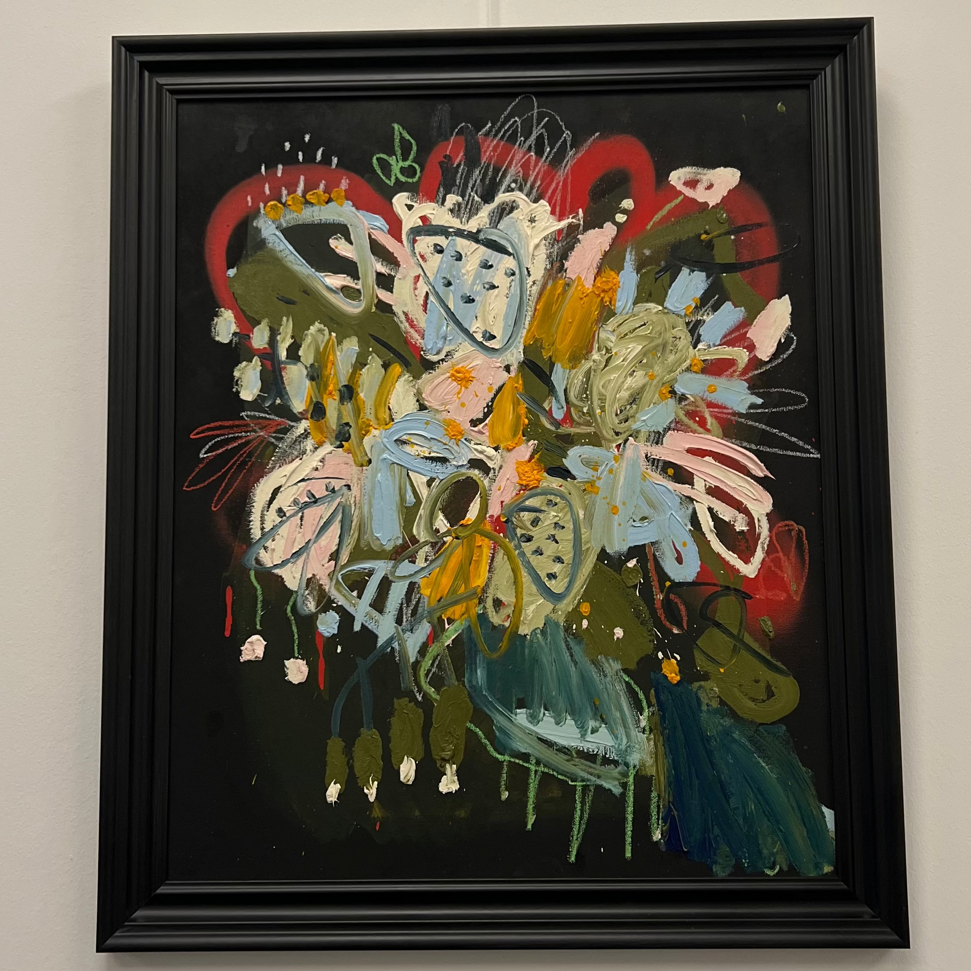 Energetic abstract painting of a wildflower bouquet with thick impasto strokes of yellow, blue, and pink on a dark background in a black frame, available at HEADS Art Gallery.