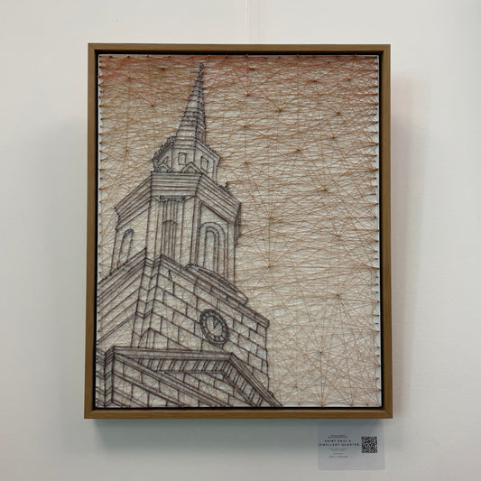 String art piece depicting a grand clock tower spire against a sunset-toned geometric background, housed in a natural wood frame, available at HEADS Art Gallery.