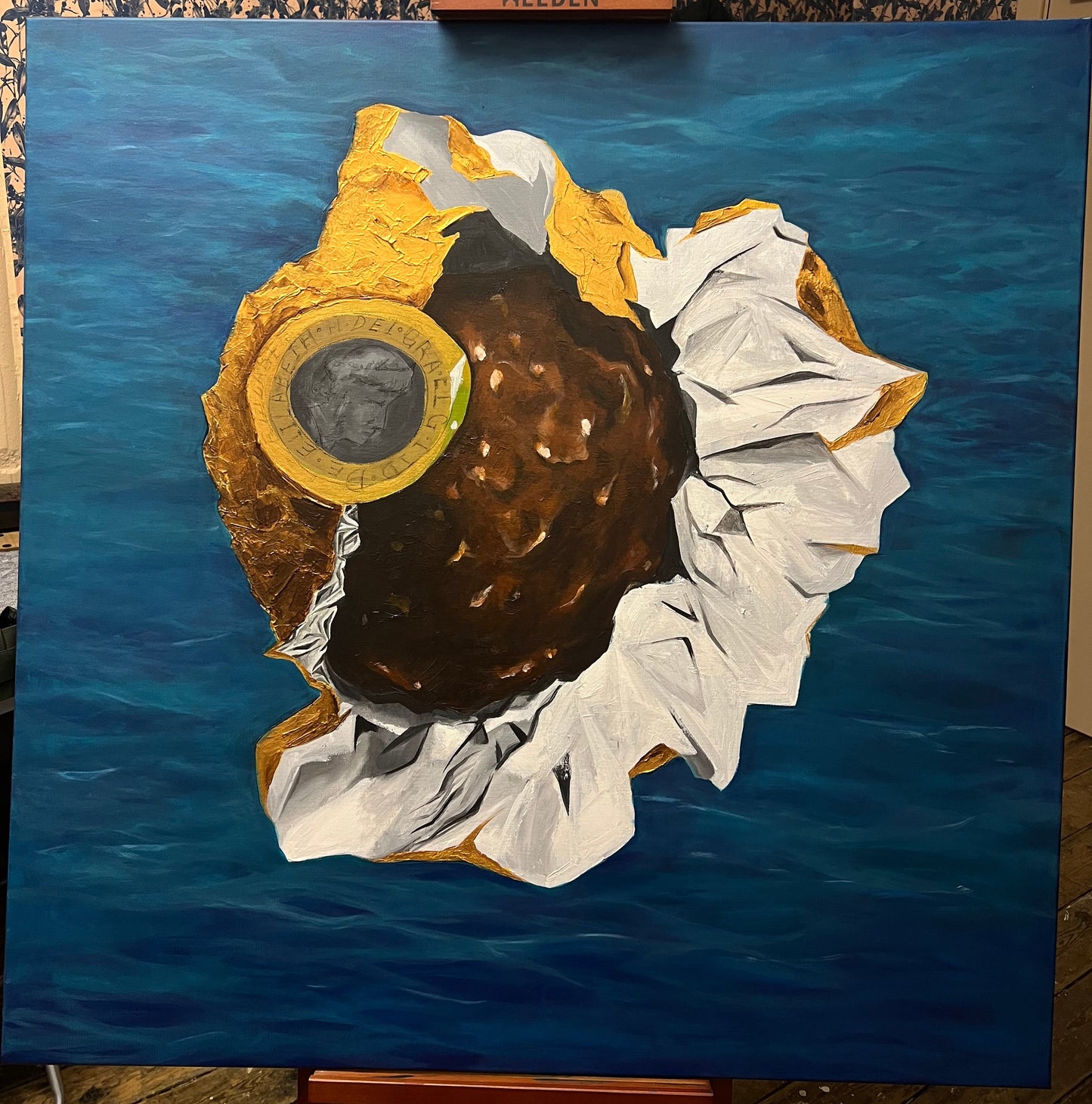 Ferrero Rocher chocolate pop art style painting in its gold and white wrapper with a British pound coin resting on top, available at HEADS Art Gallery.